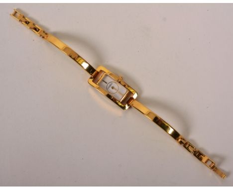 A modern lady's wristwatch by Michel Herbelin, Paris, gold coloured with mother of pearl style dial and flexible bracelet, in