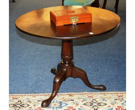 A George III mahogany supper table, with circular snap top, raised on turned column and tripod supports, 71.5cm high x 92cm w