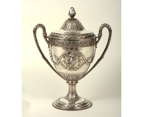 A George III silver Regimental Trophy, London 1802 by Peter Anneand William Bateman, the floral finial over leaf decoration, 