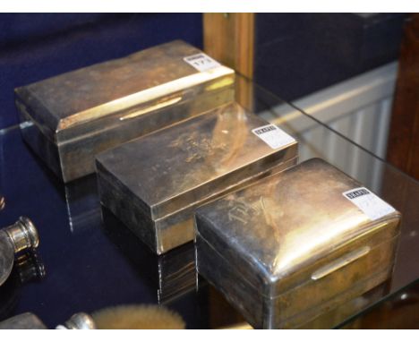 Three silver cigarette boxes, London 1920 FH, London 1883 and London 1919, each with monogram (3) CONDITION REPORT: Lot 173 -