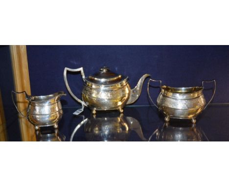 A late George III silver three piece teaset, London 1809 by Thomas Wallis & Jonathan Hayne, comprising of teapot, sugar bowl 