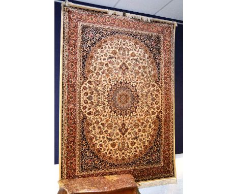 A Kashan motif wall hanging/carpet, the central medallion over cream ground and allover floral design and border, 230 x 160cm