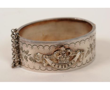 A silver bangle commemorating Queen Victoria's Diamond Jubilee, with crown jubilee decoration to front, hallmarks for Birming