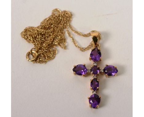 A 9ct gold amethyst and diamond crucifix pendant, the six amethysts set in cross formation interspersed by four mili diamonds