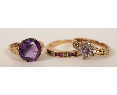 A 9ct gold large amethyst solitaire ring, 4.2g, ring size N, together with a 9ct gold ruby and diamond half eternity ring, 2.