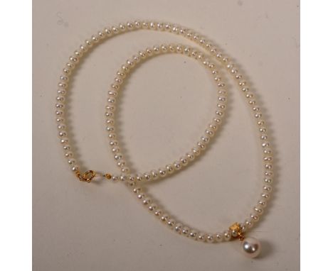 A string of pearls, with 18ct gold clasp and larger central pearl drop, in original case from Pearl Inn Nakagiri, 22cm long