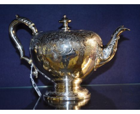 A Victorian silver teapot, London 1839 by Joseph Angel, with turned finial, tapering trunk, plinth base and acanthus spout an