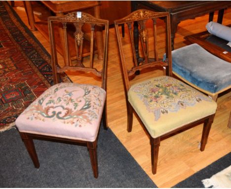 A pair of Edwardian rosewood inlaid parlour chairs, with satinwood inlaid swag and urn decoration, embroidered seats, raised 