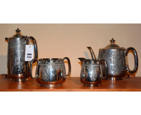 A plated tea service by Walker & Hall Sheffield, comprising of hot water jug, teapot, sugar and cream, with engraved foliate 
