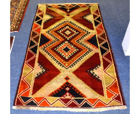 A Shiraz Gabbeh carpet, with allover dog tooth diamond design and border, 187 x 110cm