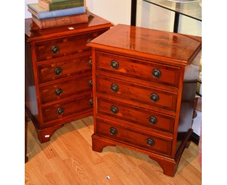 A pair of modern yewwood bedside chests, each with four graduated drawers, raised on bracket supports, 64cm high x 50cm wide