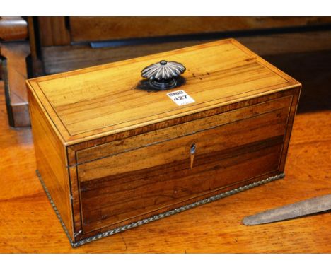 A Regency rosewood tea caddy, with hinged lid and flat pommel handle, enclosing mixing glass, lacking interior, 14cm high x 3