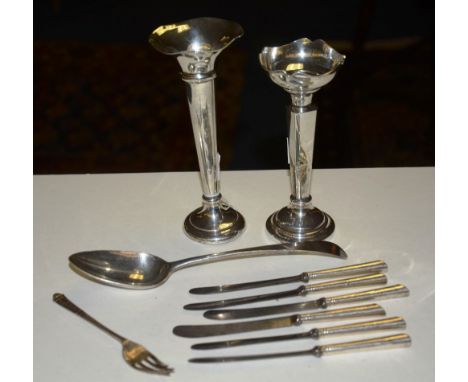 Two silver posy vases, a late George III silver spoon dated 1797 by Samuel Godbehere & Edward Wigan, six silver handles butte