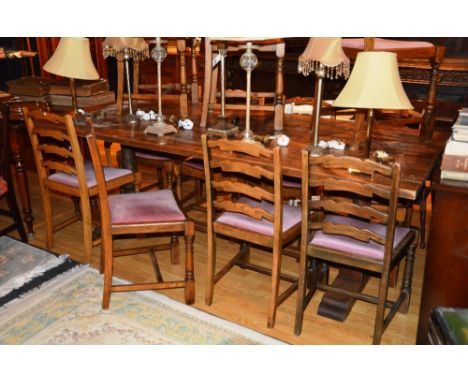 A refectory table, with plank top raised on turned supports, 79cm high x 213cm long x 101cm wide, together with 11 similar oa