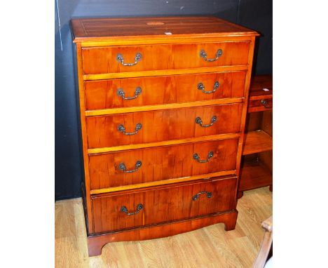 A modern yewwood chest of drawers, with five graduated drawers, raised on bracket supports, 111cm high x 80cm wide