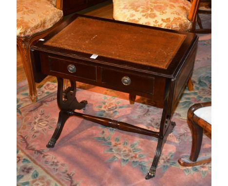 A modern sofa style telephone table, with brown leather inset above two drawers, raised on lyre supports, 56cm high x 87cm wi