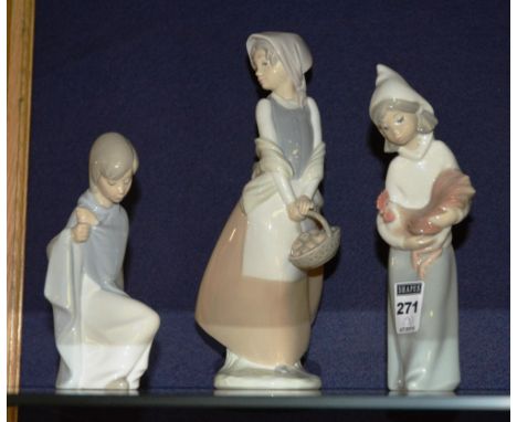 Two Lladro girl figures, one holding a chicken, the other wearing a robe, 15 & 20cm high, together with a Nao figure of a gir