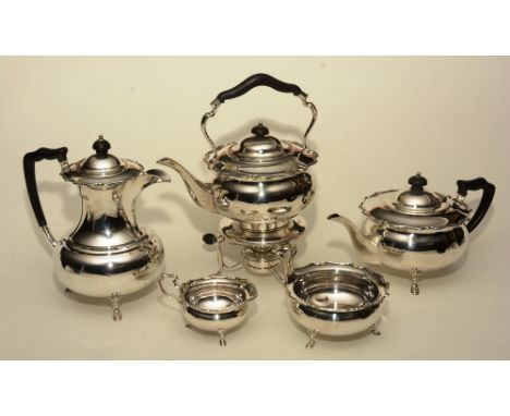 A silver tea service, by Wilson & Sharp, London 1915-16, comprising of teapot, hot water jug, spirit kettle on stand, cream a