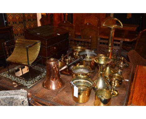 A large collection of brass and copper wares, to include coal box, wall mirror, toasting fork, jardiniere etc, together with 