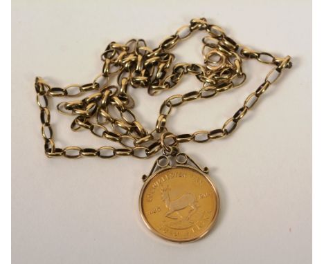 A gold South African half pound coin made into a pendant, dated 1979, on 9ct gold link chain, 10.7g, 27cm long