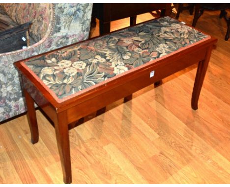 A mahogany duet piano stool, with floral embroidered decoration to hinged top, 51cm high x 99cm wide