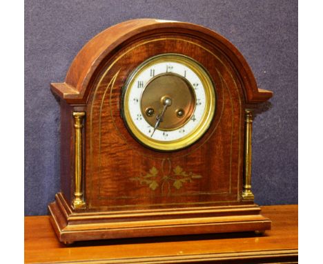 An Edwardian mahogany inlaid mantle clock, with cream enamel chapter ring and Roman numerals, 27cm high