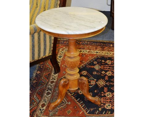 A Victorian style hardwood circular occasional table with white marble top above turned column, ending in tripod supports, 69