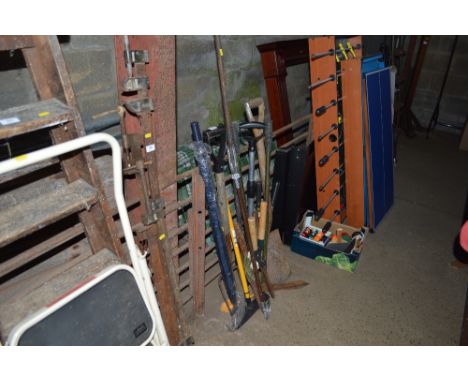 A bird feeder; together with a quantity of gardening tools; a shooting stick