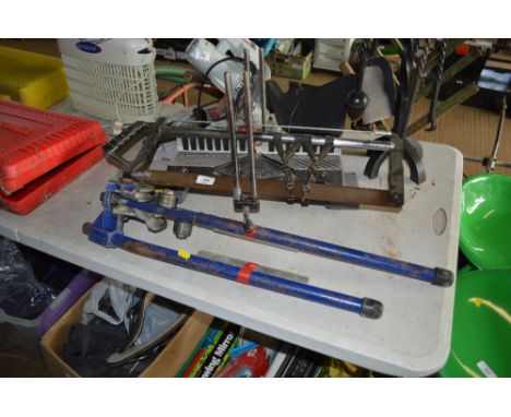 A Pipe bender together with a mitre saw