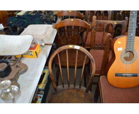 A stick back dining chair together with a set of four oak spindle back chairs