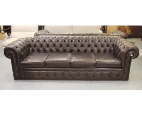 Large dark tan buttoned leather upholstered Chesterfield settee, 255cm wide