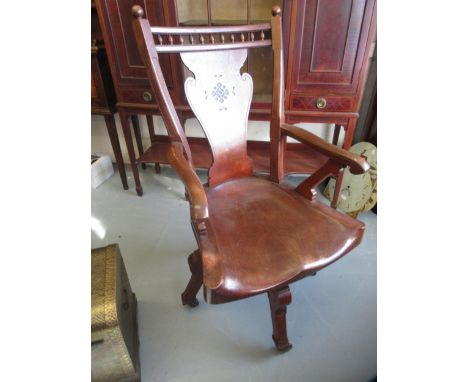 Late Victorian oak swivel office chair with a shaped splat and bobbin turned back, moulded panel seat and shaped arms