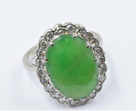 18ct White gold oval jade and diamond set dress ring, size M, 5.3gSome superficial scratching from general wear but  no notab