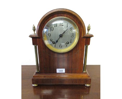 Late 19th / early 20th Century rosewood cased mantel clock having gilt metal mounts, the circular silvered dial with Arabic n