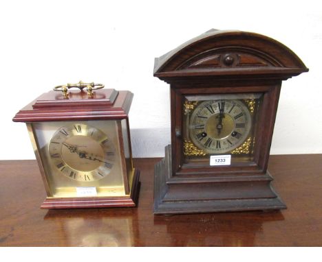 Late 19th Century German oak cased two train mantel clock, together with a reproduction quartz mantel clock