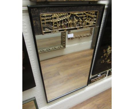 Chinese rectangular ebonised and parcel gilt wall mirror with a carved pictorial frieze, together with a pair of similar smal