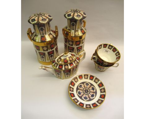 Pair of small bone china porcelain vases in the form of milk churns, 27cm high, together with matching teawareSome wear to gi