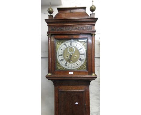 18th Century oak longcase clock, the pagoda hood with brass finials and blind fretwork frieze above a rectangular panel door 