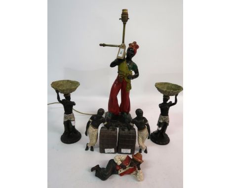 Painted plaster figural table lamp, pair of blackamoor comports, pair of similar bookends, a reclining figure and a nickel pl