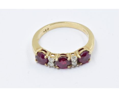 9ct Gold dress ring set three rubies interspaced with four small diamonds, size O, 3.2g