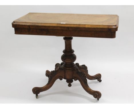 Victorian figured walnut rectangular fold-over card table on a turned and carved column support with quadruped base, 91cm wid