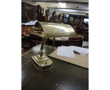 Good quality brass banker's lamp with spiral twist decoration and adjustable shadeIn good condition, needs a polish. 40cm hig