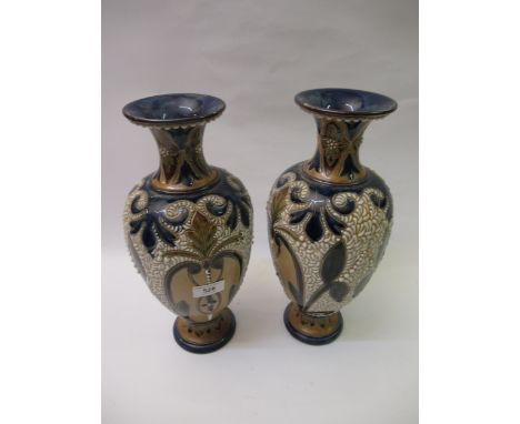 Pair of large Fulham pottery stoneware vases, with relief moulded decoration, incised monogram C.J. to the bases, 35cm high (