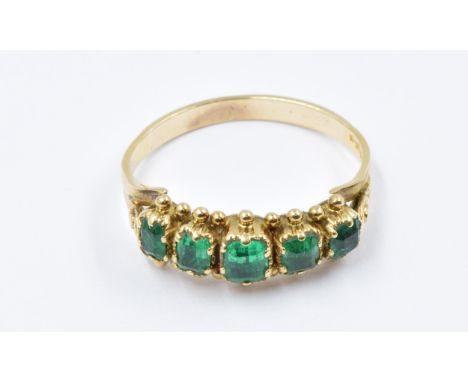 19th Century five stone emerald ring set in yellow metal with partial mark 2.4gRing size M/N. Two of the central stones are c