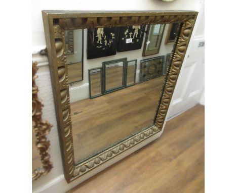 19th Century rectangular gilt framed wall mirror with heavily gadroon carved decoration and original plate, 92 x 105cm