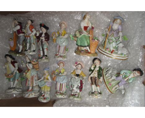 Group of thirteen Sitzendorf hand painted porcelain figures