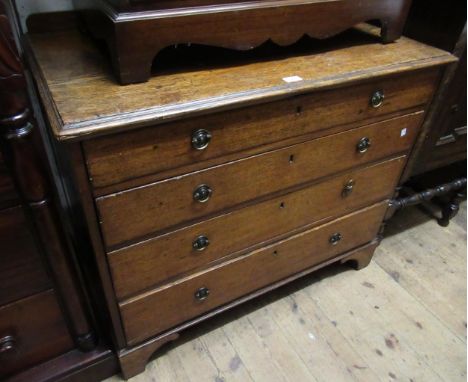 George III oak chest of four graduated drawers with circular brass ring handles and bracket feet, 99cm wide