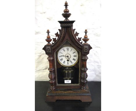 Late 19th Century American single train mantel clock, the circular paper dial with Roman numerals and single train movement, 