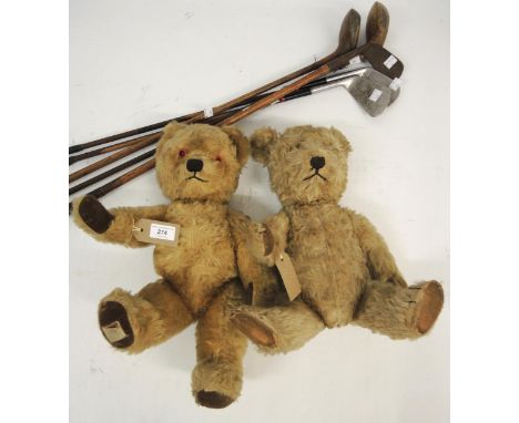 Two vintage teddy bears, together with five hickory shafted golf clubsThe eyes are glass. Left bear is 50cm and the right bea