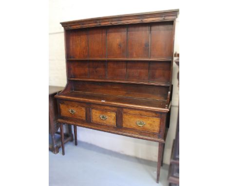 Small 18th Century oak dresser having a shelf back above three short drawers on square tapering supports, 143cm wide x 38cm d